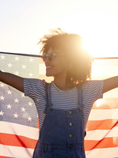 woman with american flag interesting facts about 4th of july