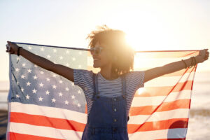 woman with american flag interesting facts about 4th of july