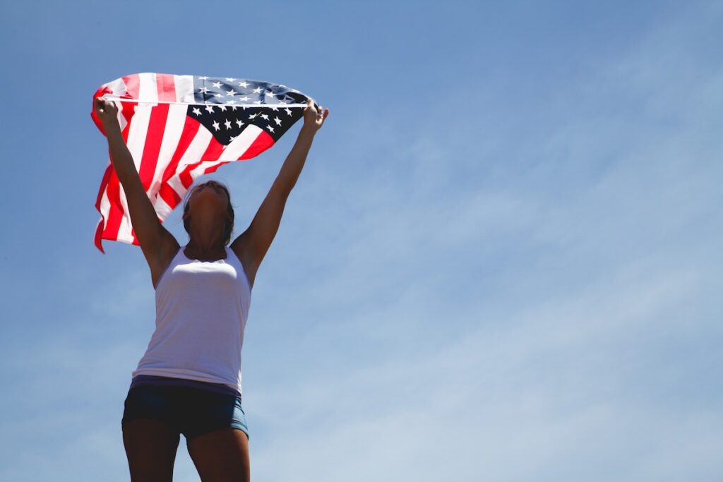 american-woman-holding-flag