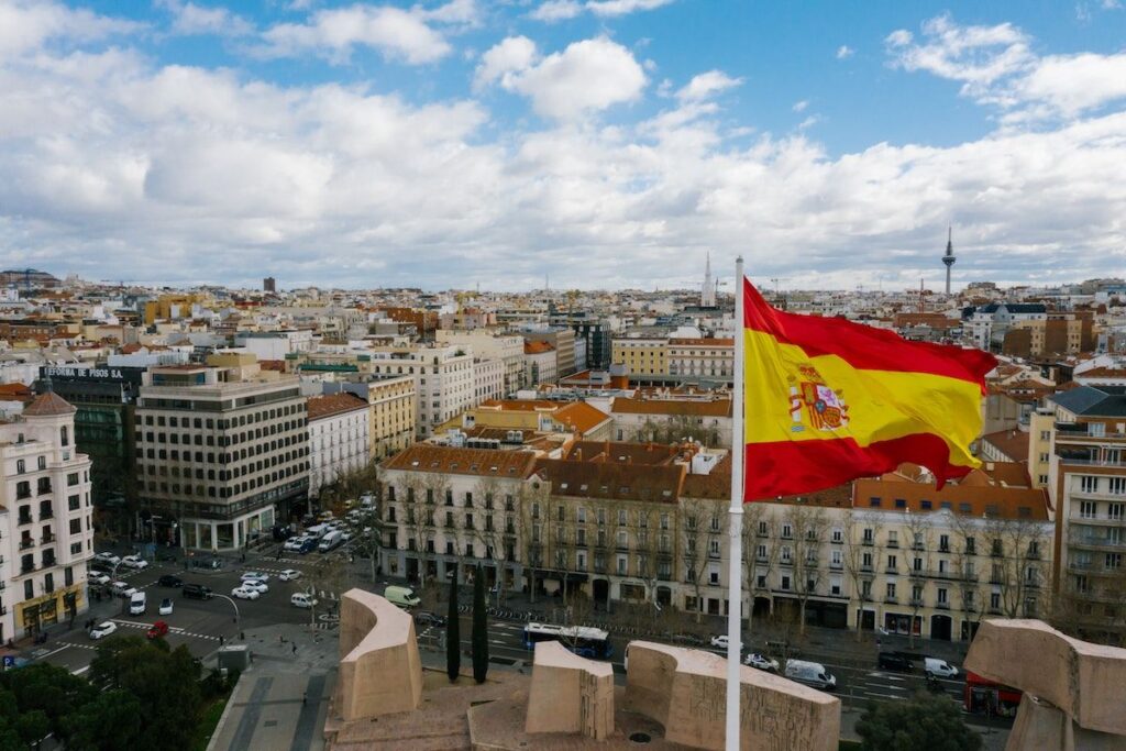 Spain-City-Skyline-with-Flag facts about the history of spain