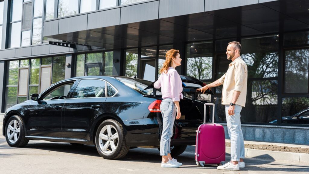traveling couple renting a car