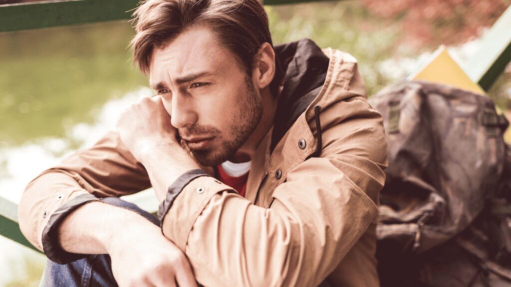 sad man outside thinking depressed