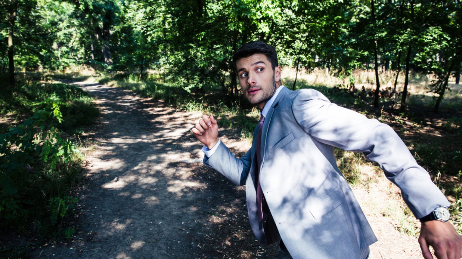 Businessman running away from something