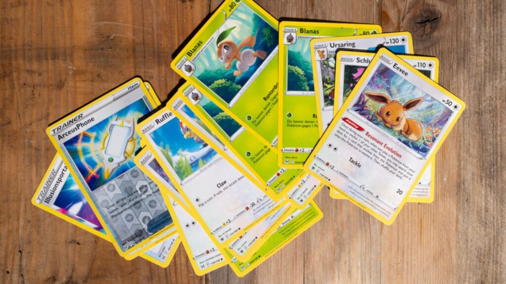 Collection of Pokémon Trading Cards placed at a wooden surface