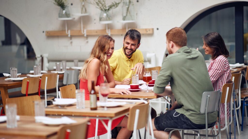 Friends laughing and enjoying at coffee together
