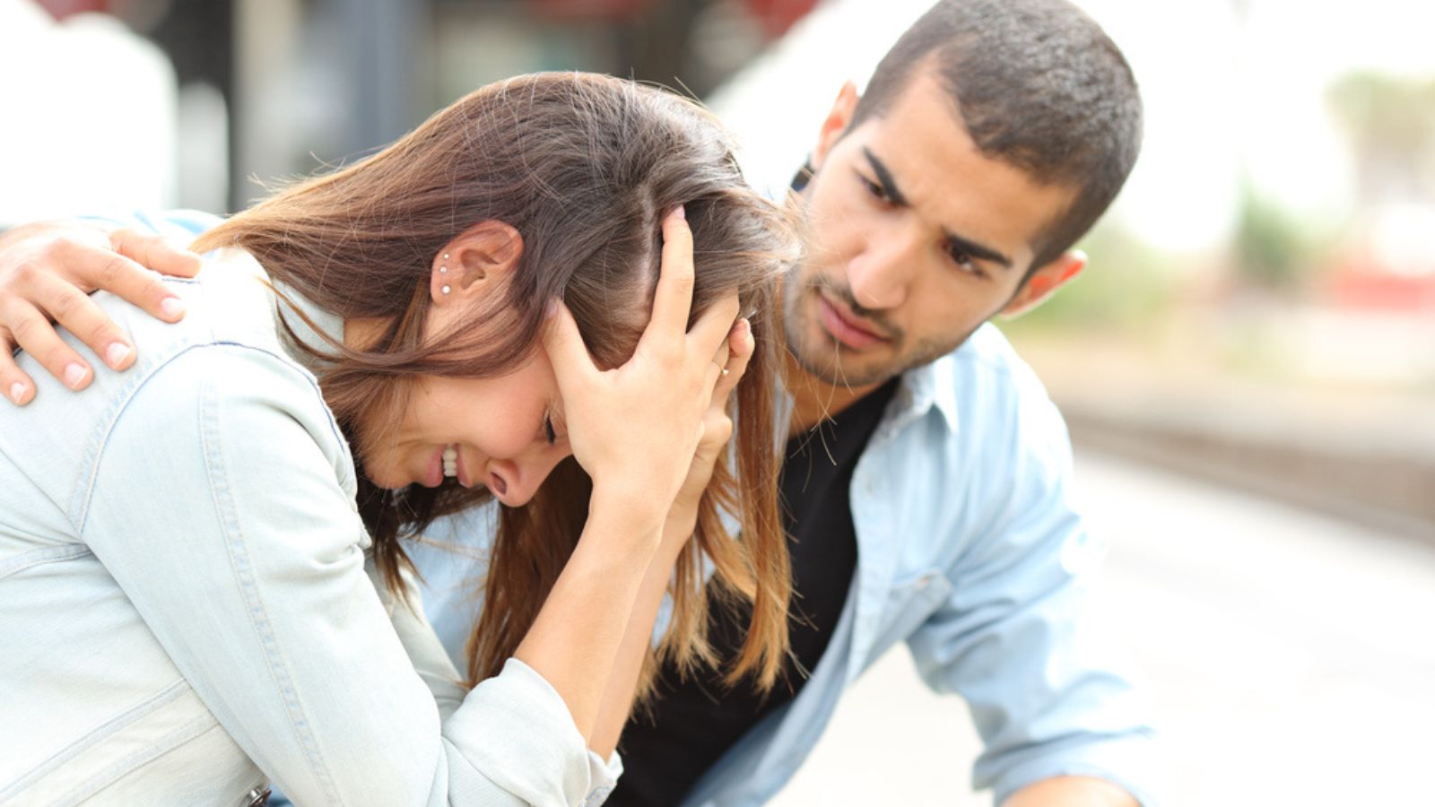 Muslim man comforting a sad girl mourning