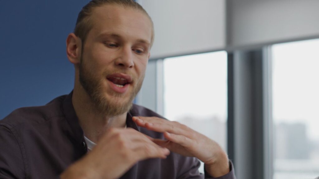 man is talking quickly and trying to explain something