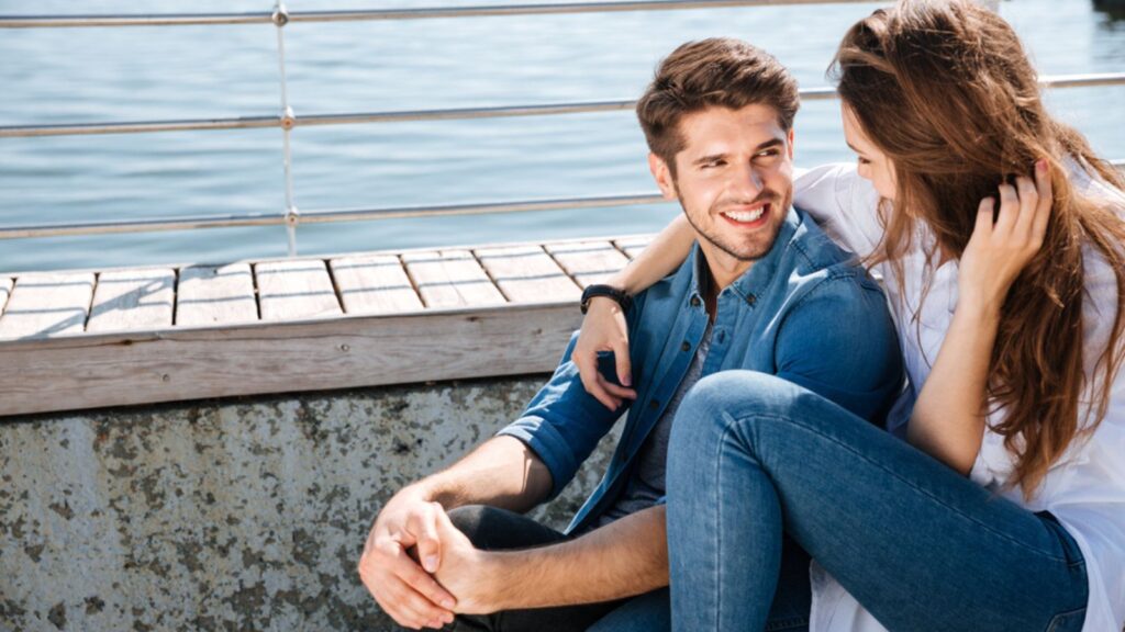 smiling young couple looking at each other