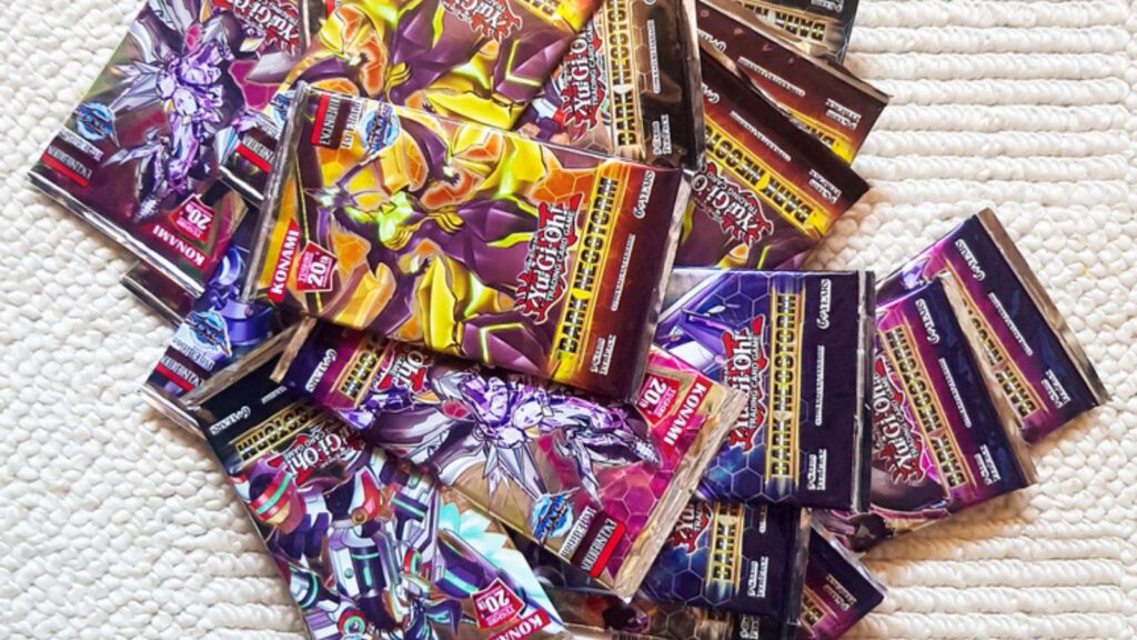 A heap of brand new Yu-Gi-Oh card booster packs laying on the carpet