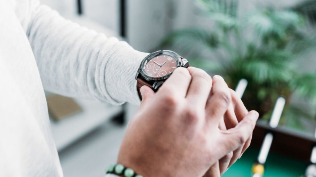 A man checking time on watch