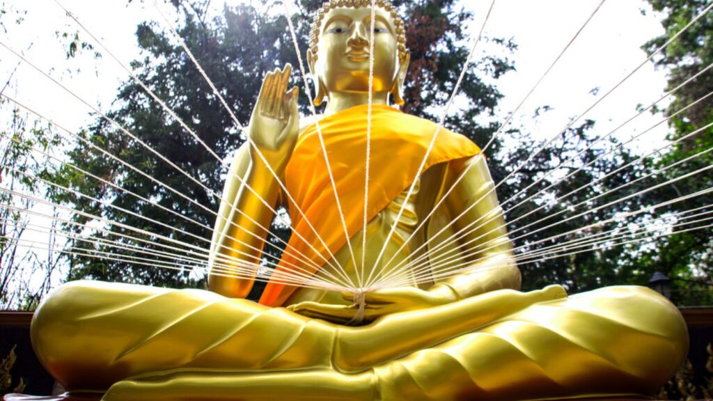Close up white rope in buddha statue hand