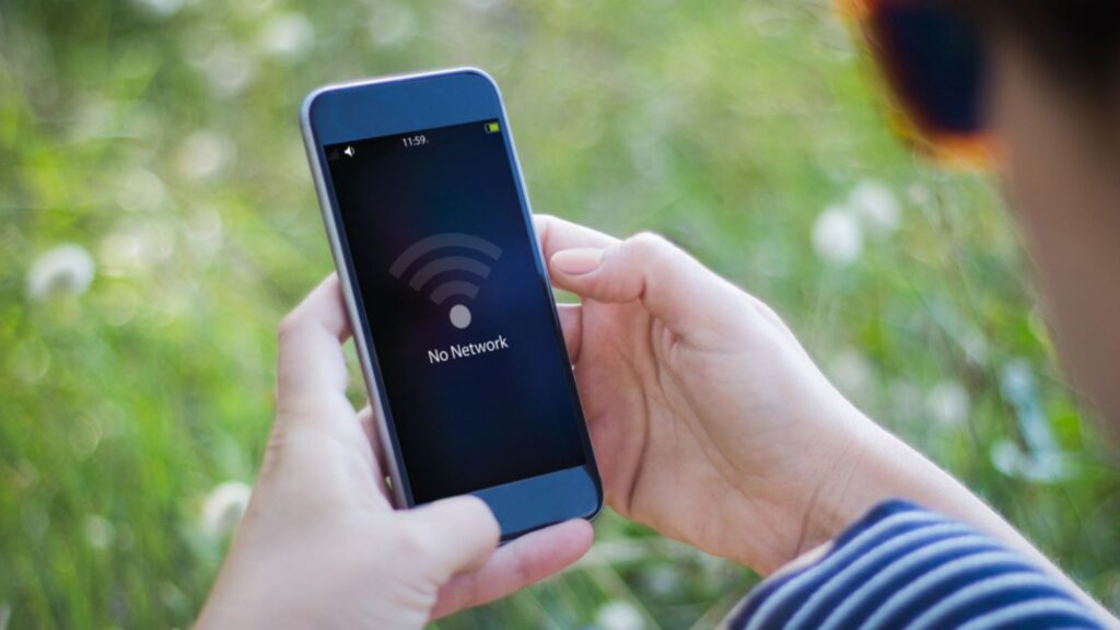Girl holding smartphone with no network