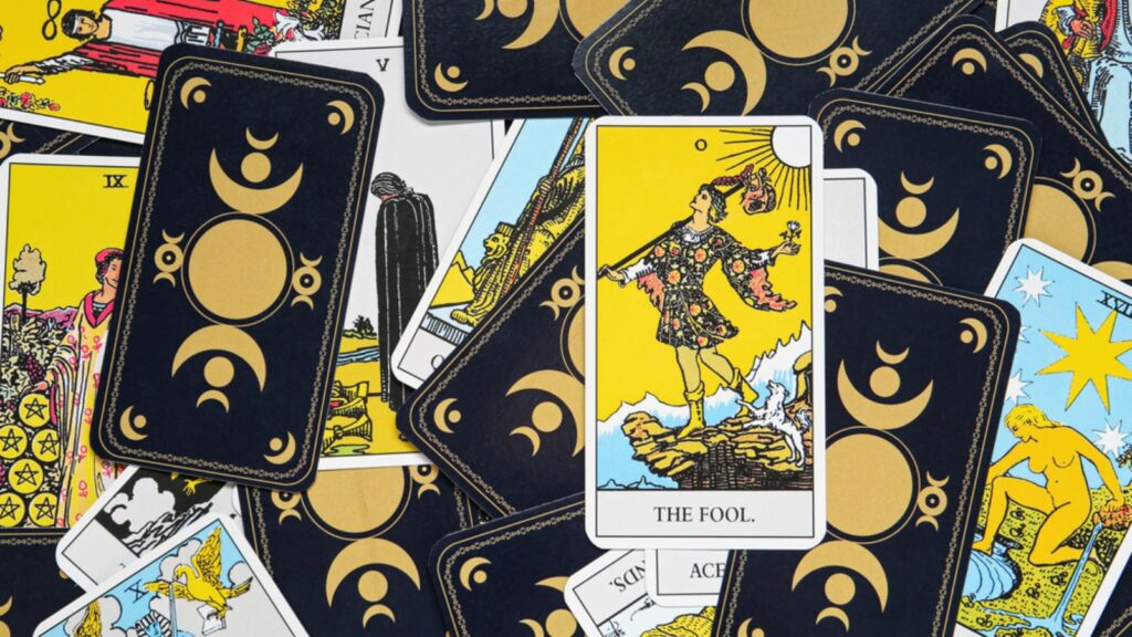 Many tarot cards as background, top view
