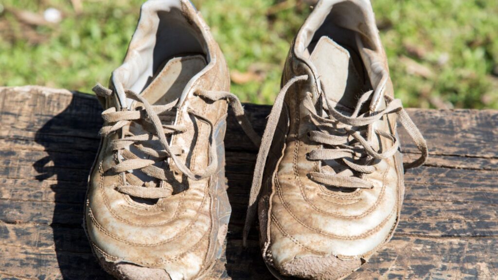 Old torn strap shoes