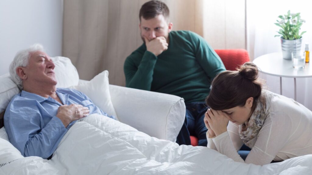 sick dying old man with his sad kids