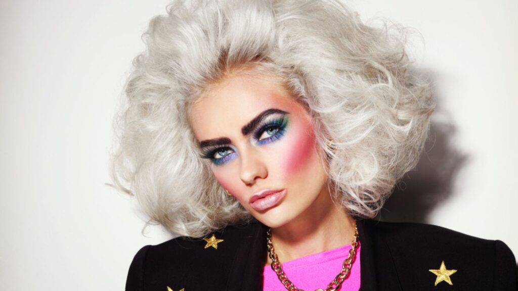 Young platinum blond woman with 80s makeup