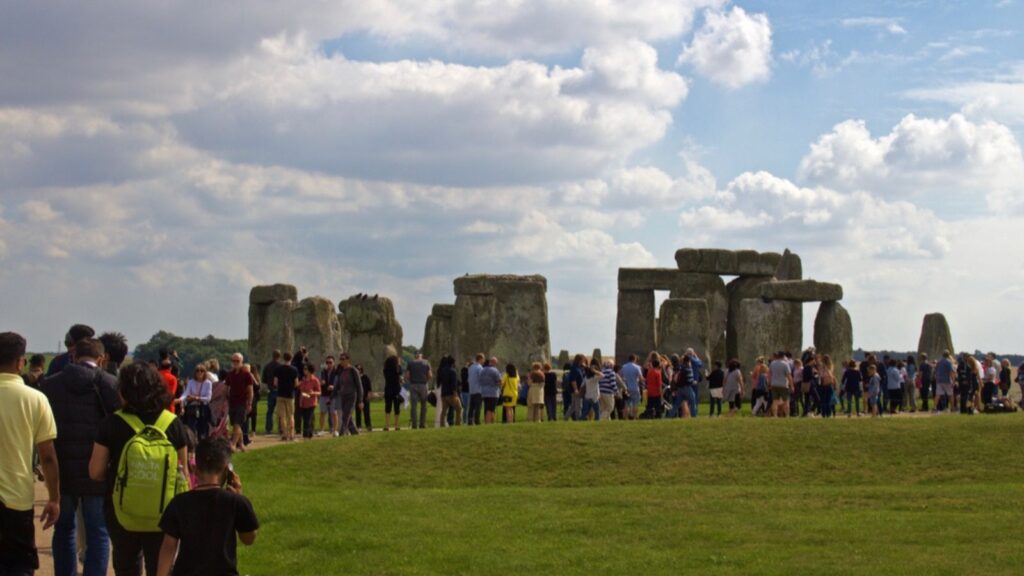 _Crowd Stands in Front of the Rocks of Stonehenge On a Cloudy Summer Day