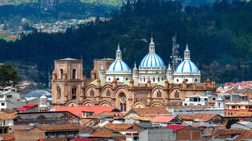 Cuenca's Cathedral La Inmaculada Concepcion, in middle of it's beautiful city, on a sunny and cloudy afternoon. Cuenca, Azuay Province, Ecuador.