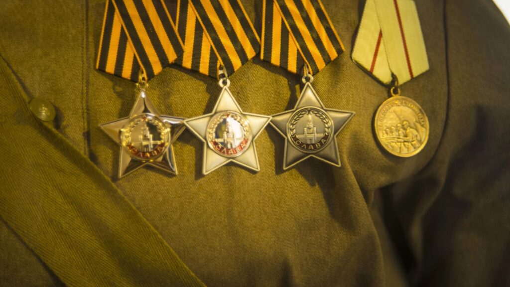 Different awards and medals on the russian army uniform. Memory of awards and medals of World War II and Great Patriot War