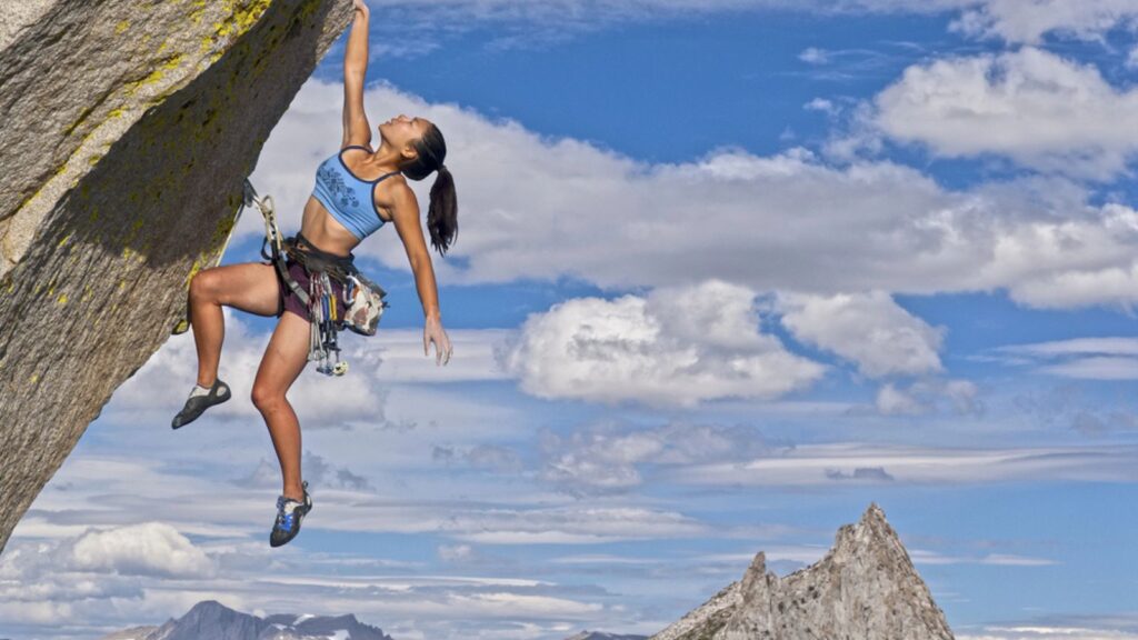 Female rock climber. focused on his goals