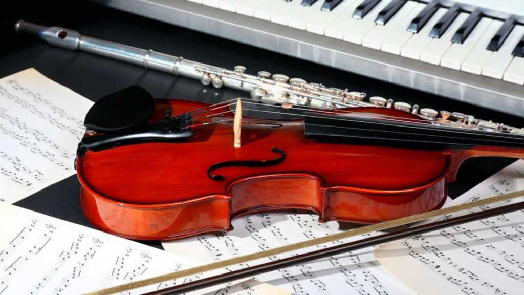 Musical instruments with music notes on dark background