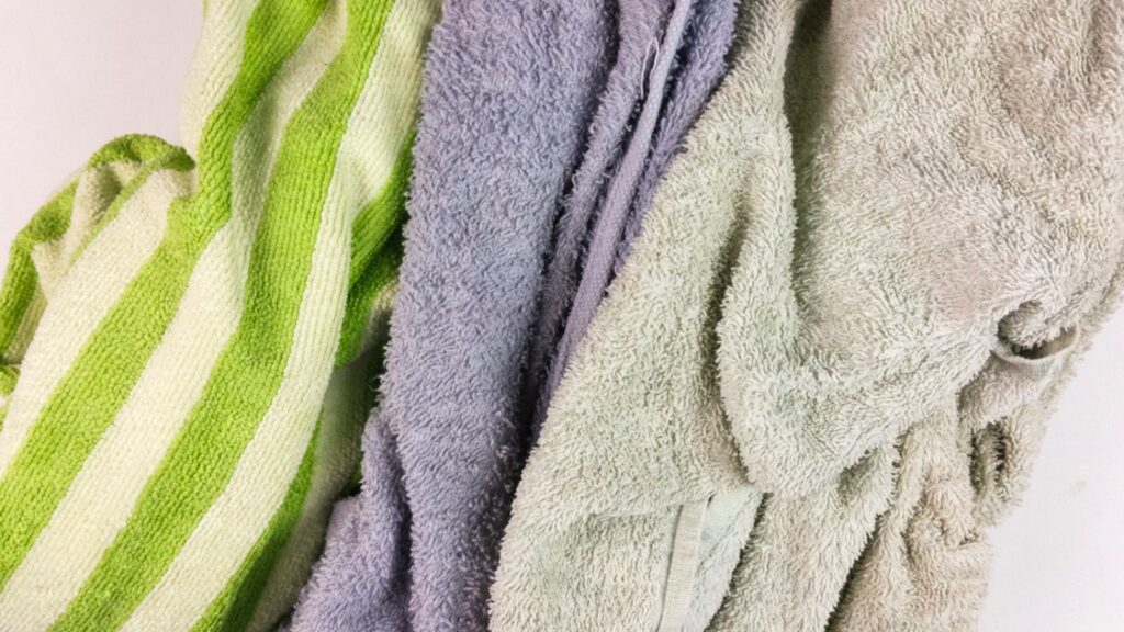 _ Old towels on white background