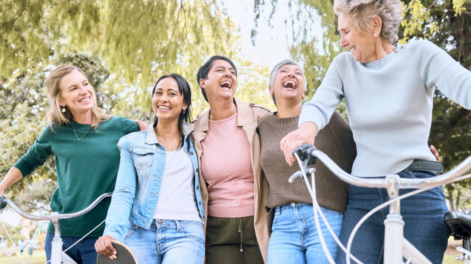 Happy senior woman, friends and laughing Group of elderly women bonding and sharing joke, laugh or walking and cycling in the outdoors.