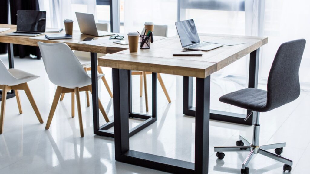 Interior of business office with laptops on tables