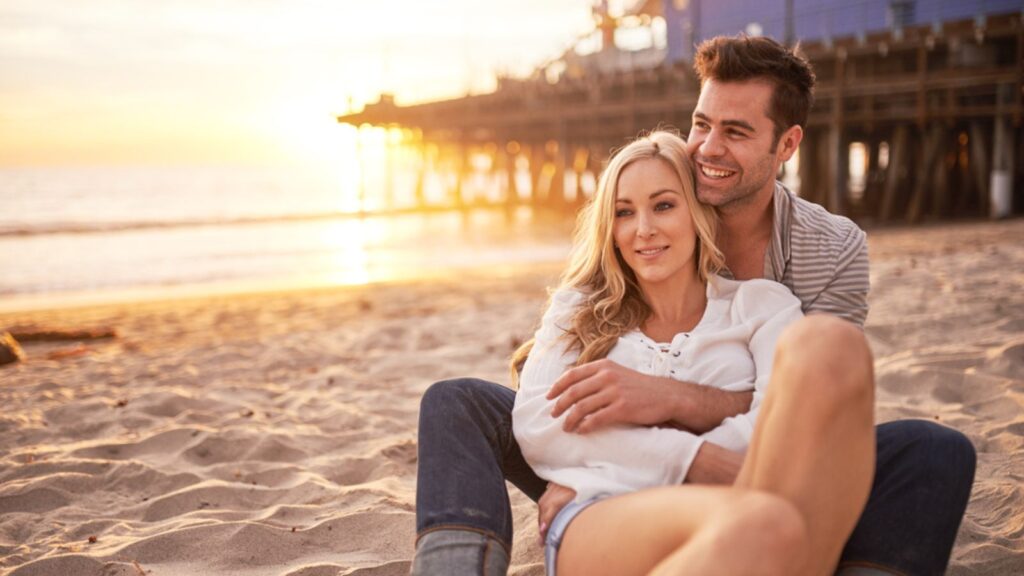 happy couple in love on the beach sunset california