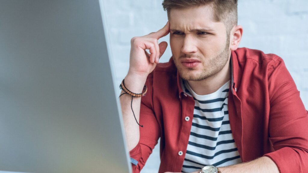 confused man at his computer