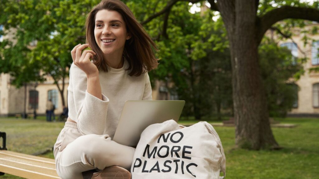 happy woman outside resusable bag no plastic
