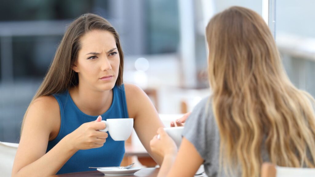 confused person having a conversation coffee cup friends