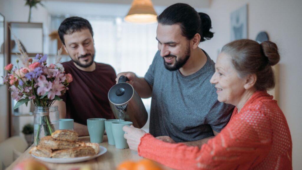 mom and sons drinking tea coffee flower family