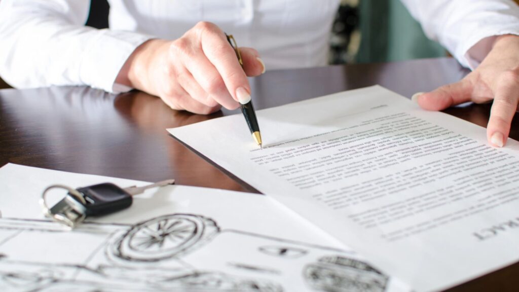 Woman reading a car purchase contract