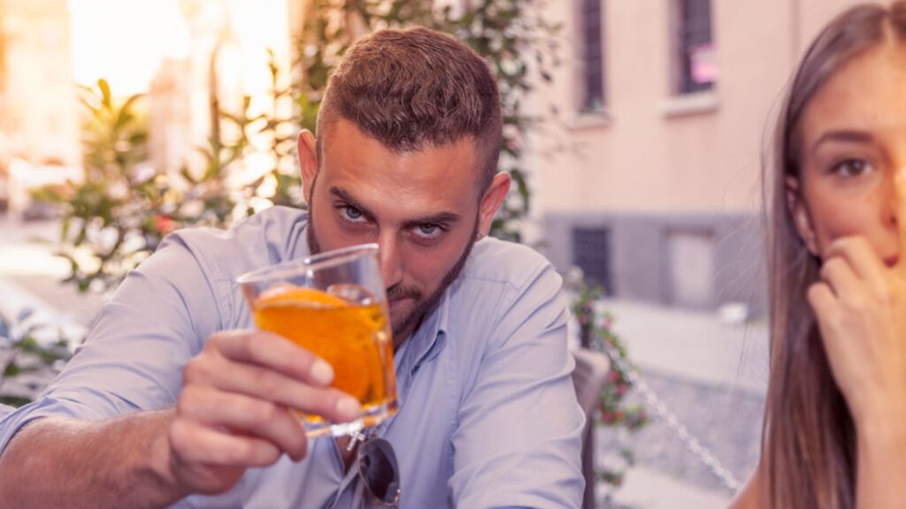 Young couple takes a drink in a downtown bar