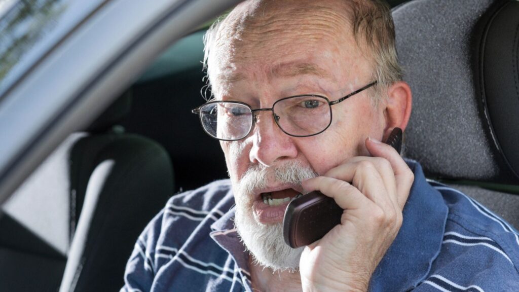 Angry Old Man Yelling on Cell Phone in Car 