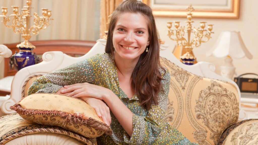 Beautiful young woman in a luxurious interior