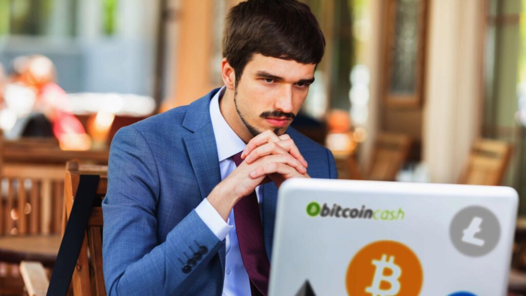 Blockchain technology. Bad news with bitcoin cryptocurrency. Succesful man hands up. Using laptop. Concept of success