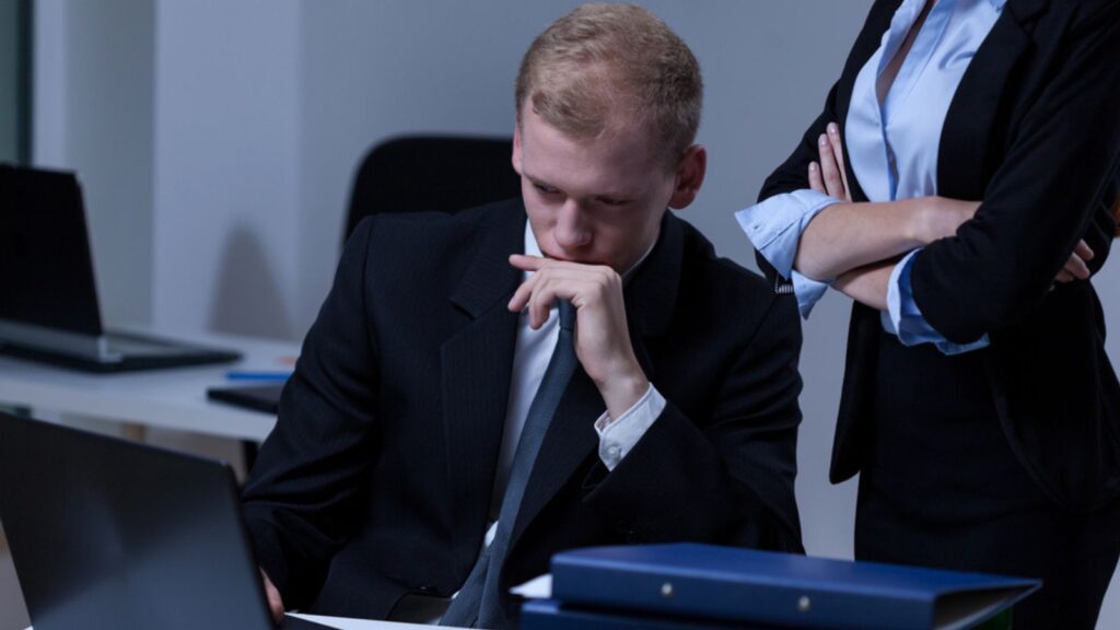 Boss checking his worker