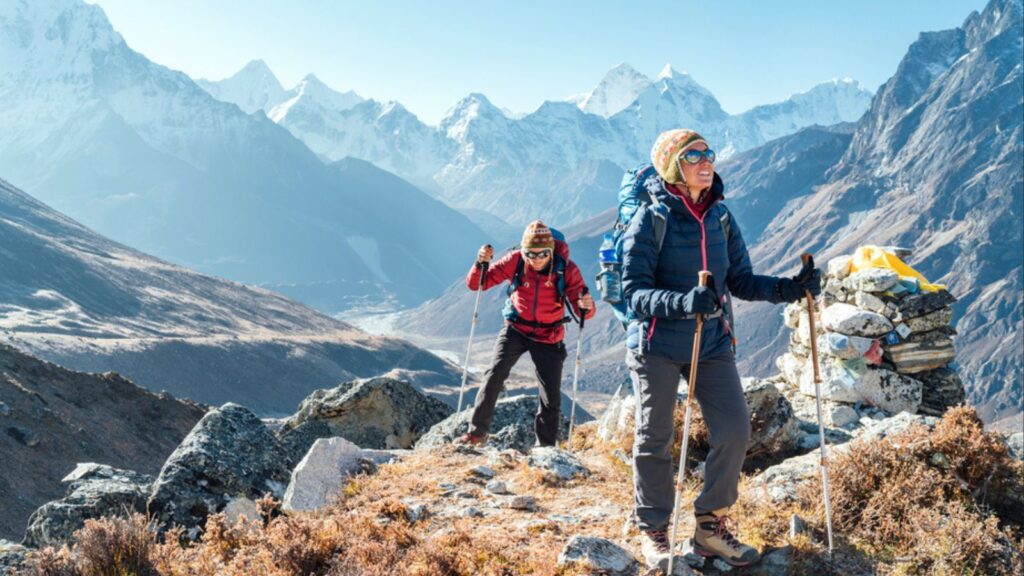 Couple following Everest Base Camp trekking route near Dughla 4620m