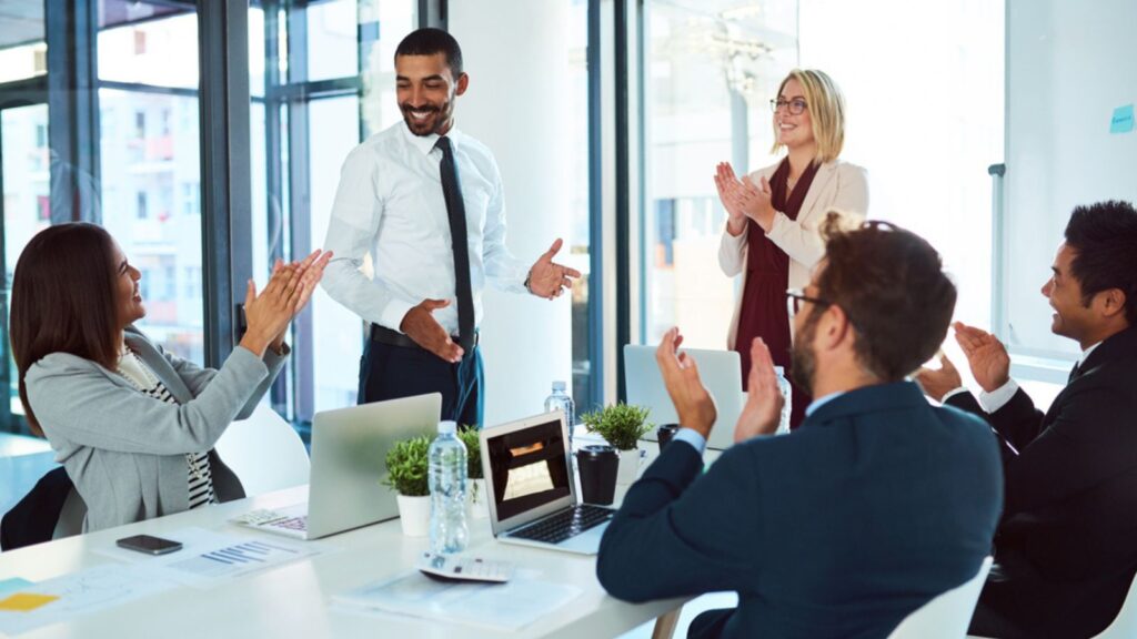 Man and woman talking about the business in group