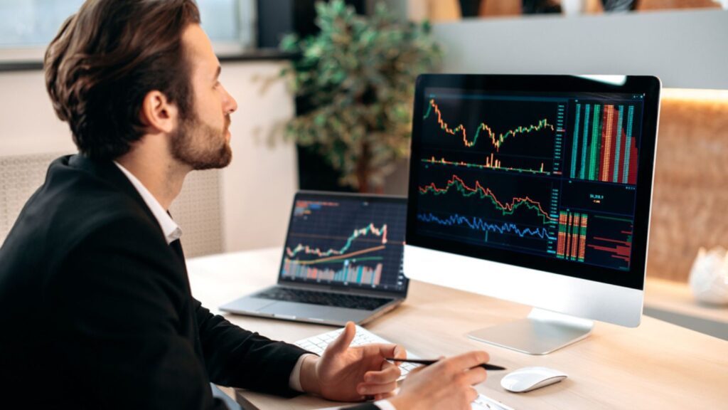 Smart stock trading man investor, analyze the financial market of cryptocurrencies, invests in e-currency, buys or sells crypto coins, analyzes financial data, predicts stock exchange market