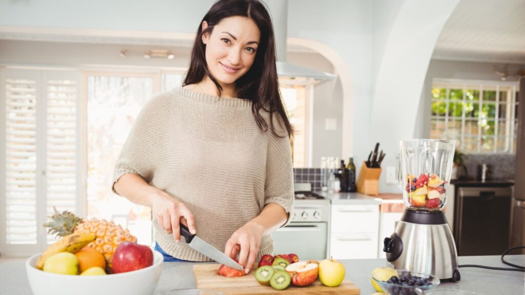 Woman cutting fruits