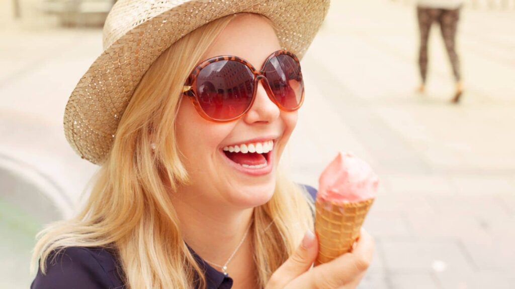 Woman eating ice cream in the city