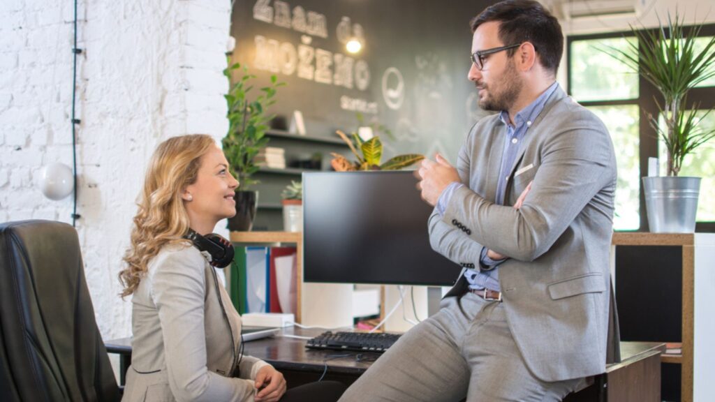 business friends talking during break in office happy engaged conversation