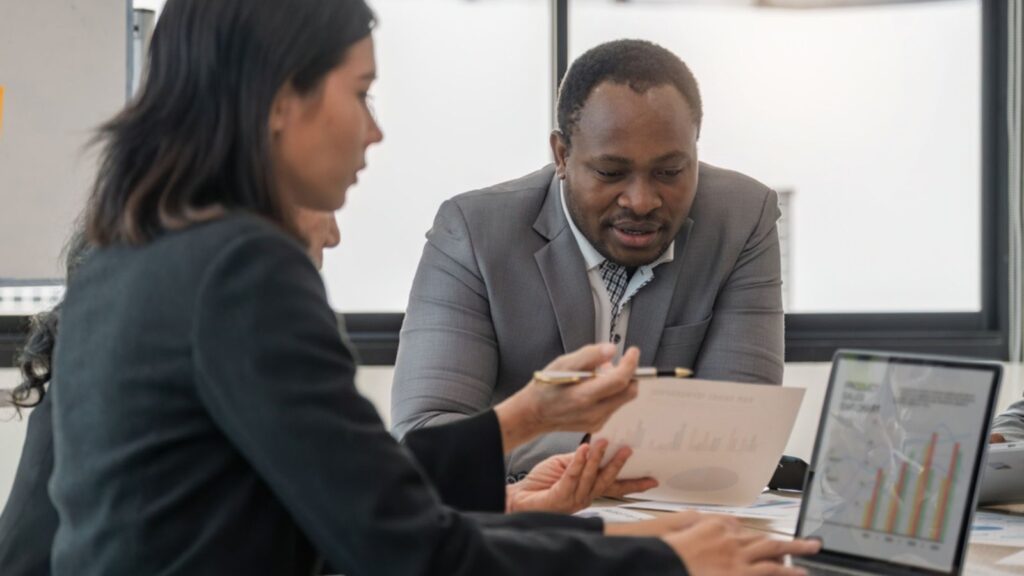 diverse professional working people discussing financial planning budgeting stock market