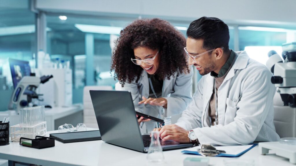 excited happy scientists laboratory research