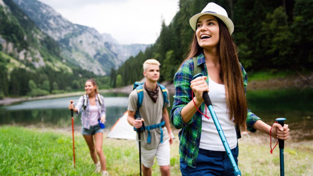 Friends hiking together outdoors exploring the wilderness and having fun