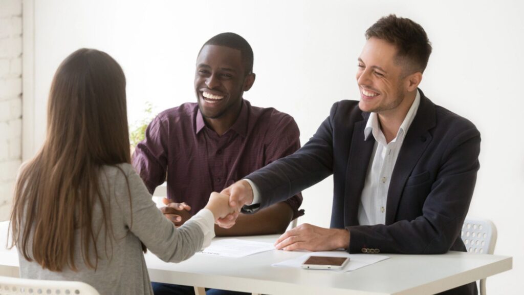 job-interview-happy-shake-hands-professionals-smiling-coworkers