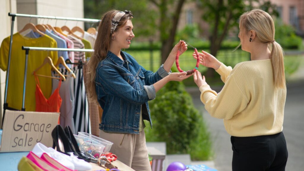 woman shopping at antique garage estate sale thrift bargain